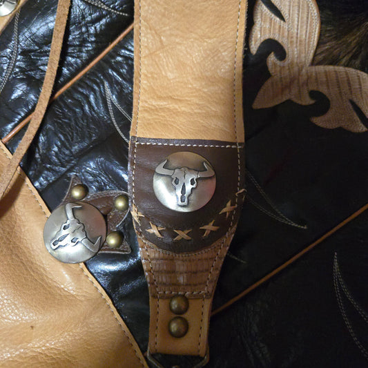 Vintage black-and-wheat cowboy boot top bag with steer skull conchos