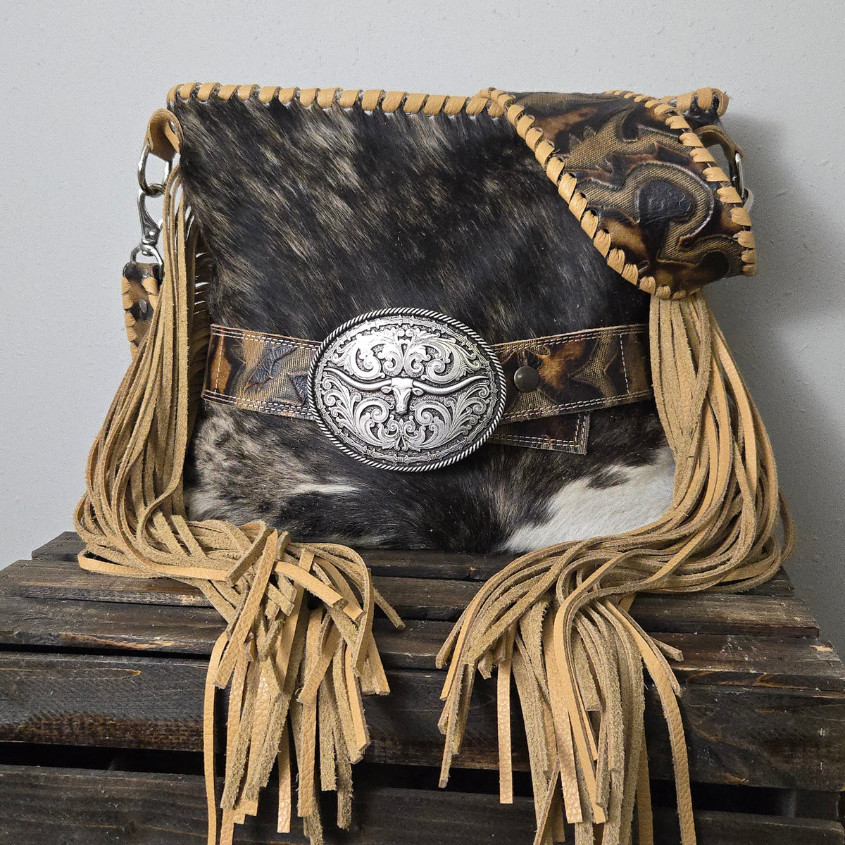 Brindle cowhide bag with Laredo-embossed leather and hand-cut fringe
