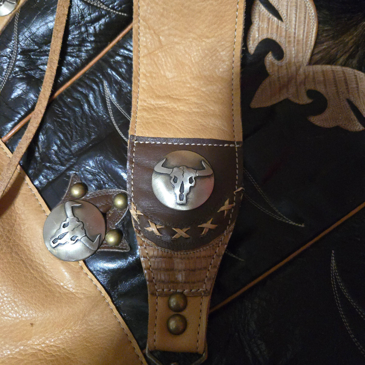 Vintage black-and-wheat cowboy boot top bag with steer skull conchos