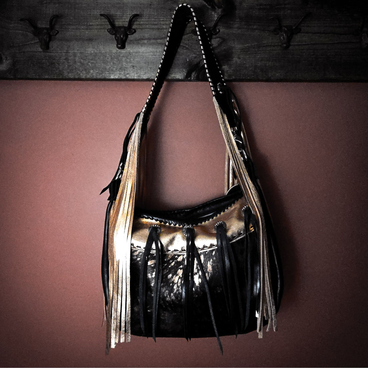 Copper metallic hobo bag with 28-inch leather shoulder strap
