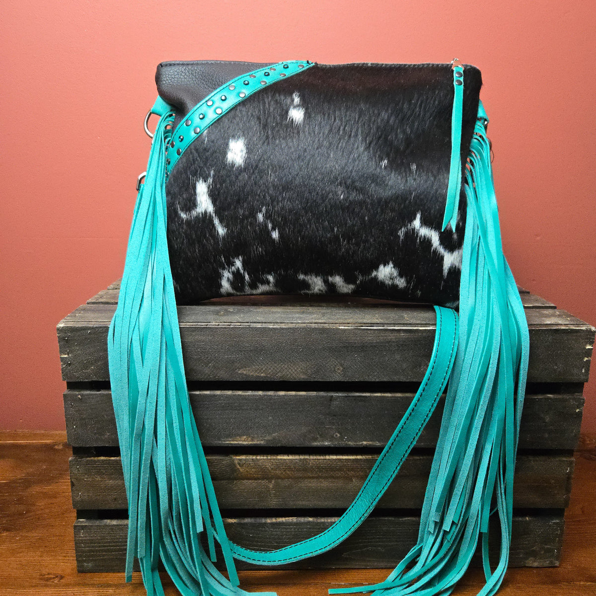 Handcrafted western fringe bag with turquoise leather and natural cowhide