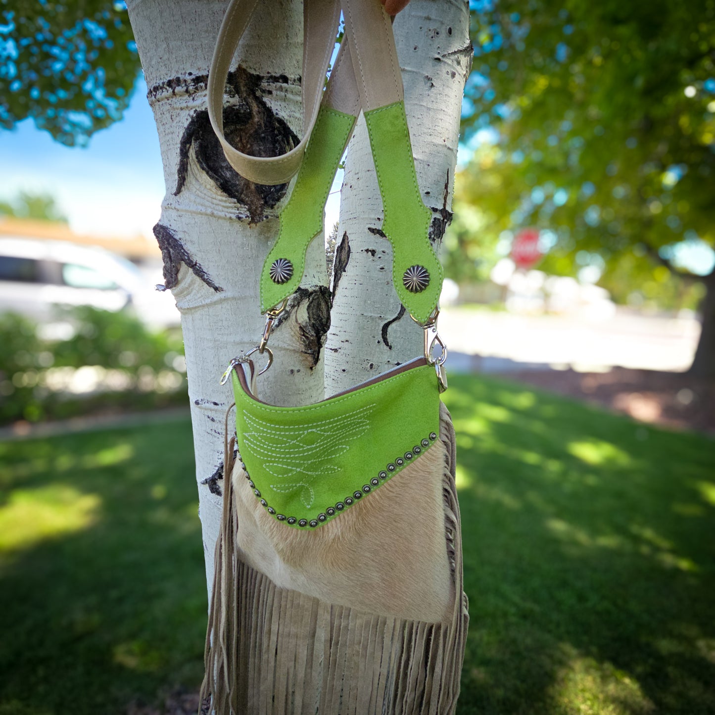 Margarita lime green suede hair-on-hide crossbody bag with fringe side view