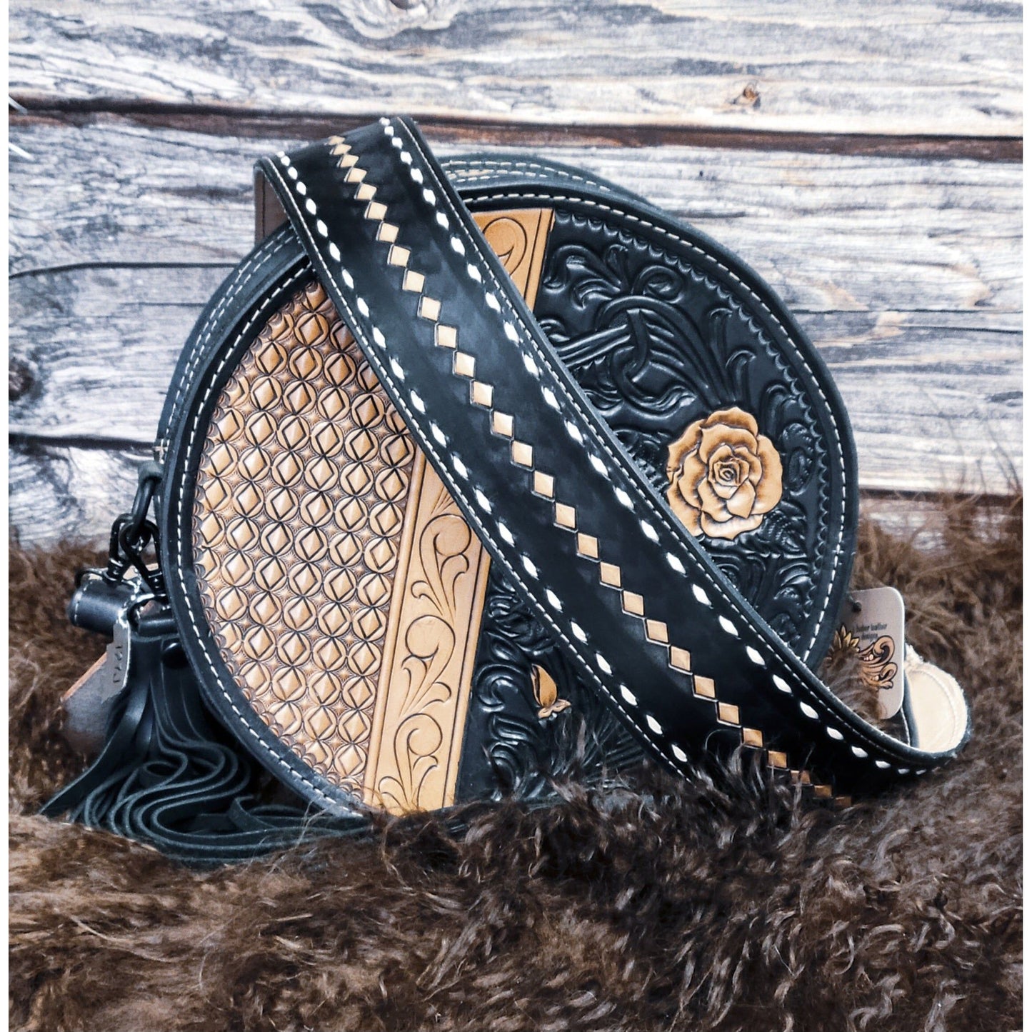 Midnight Rose hand-tooled western leather round bag with rose scroll tooling and black suede back front view
