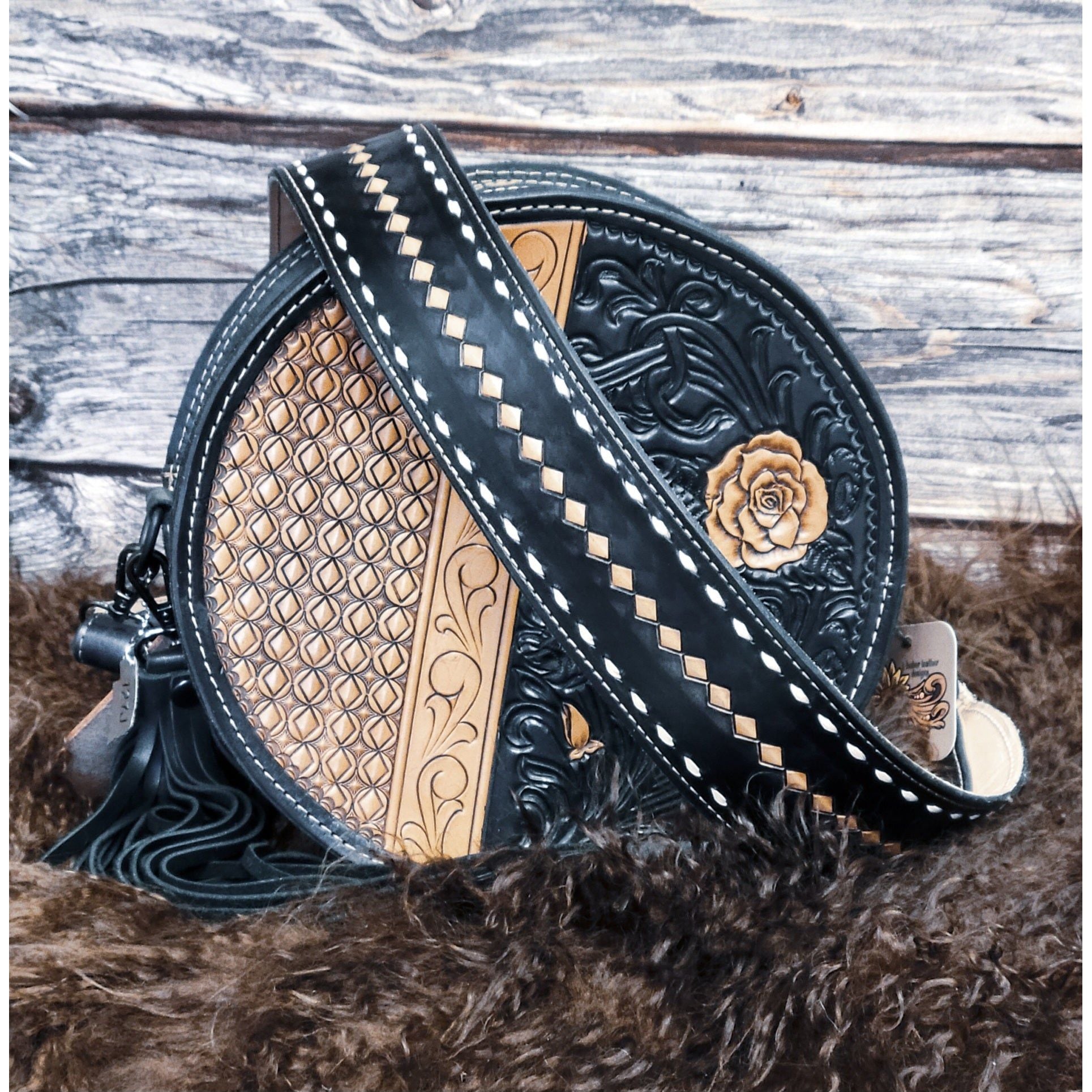 Midnight Rose hand-tooled western leather round bag with rose scroll tooling and black suede back front view