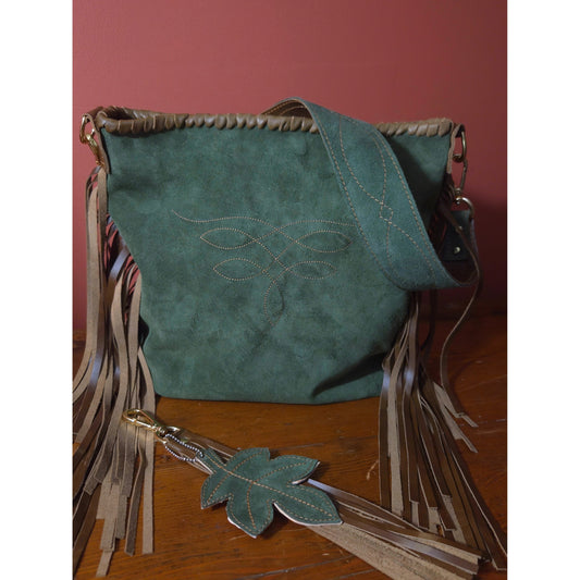 Handcrafted moss suede bag with stitched leaf design and leather-laced top