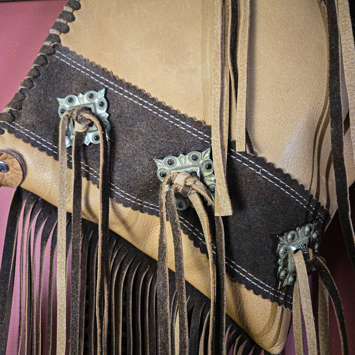 Outrider leather bag with antiqued gold-tone conchos