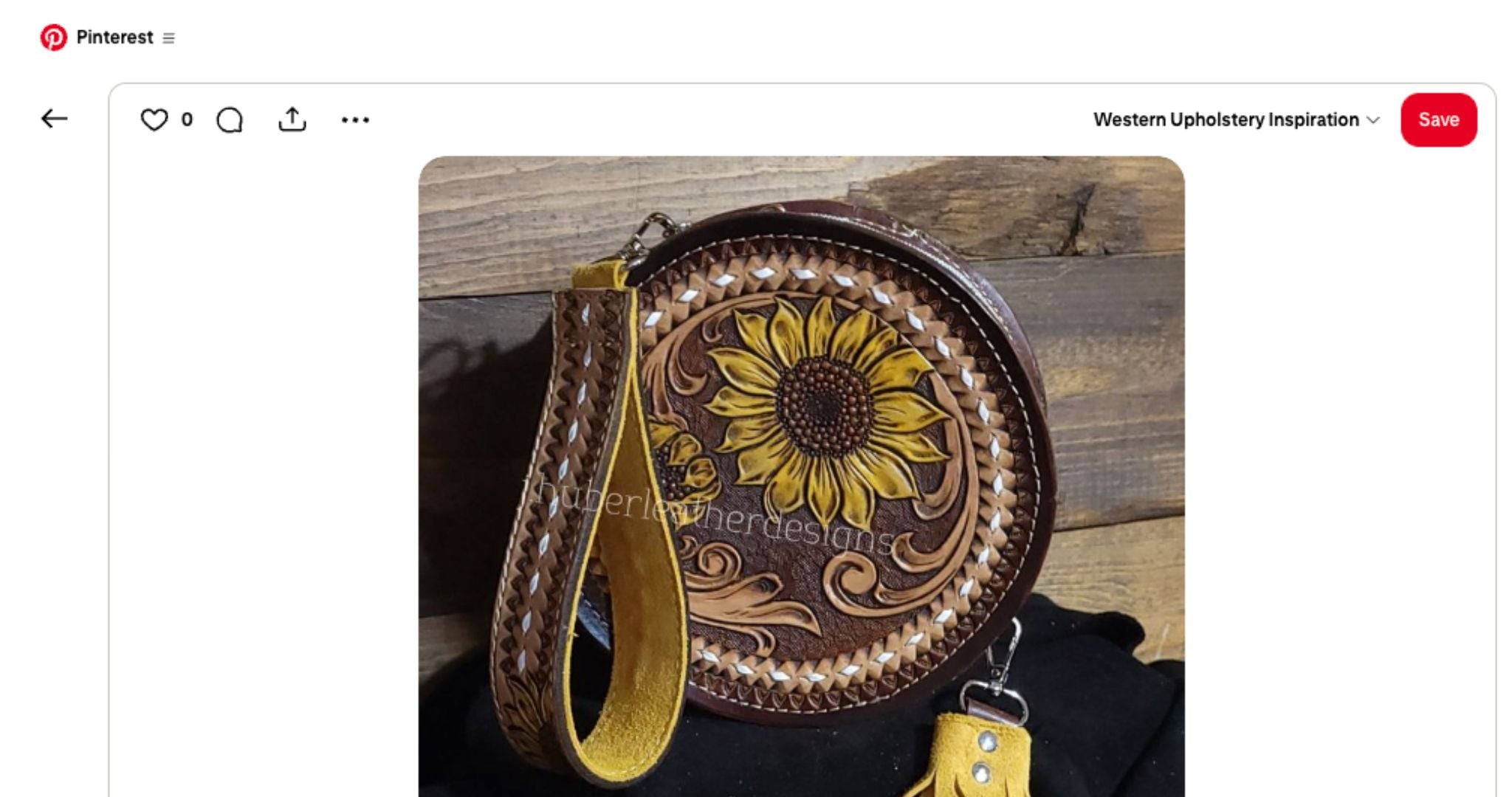 Leather handbag with sunflower design on a wooden surface in pinterest post