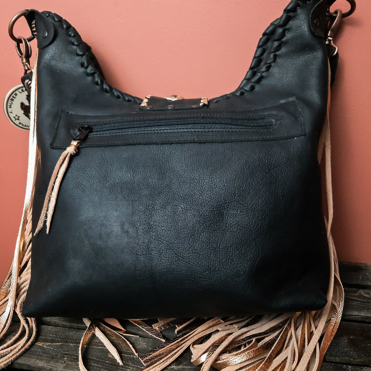 Back of copper Uptown Cowgirl bag with exterior zippered pocket