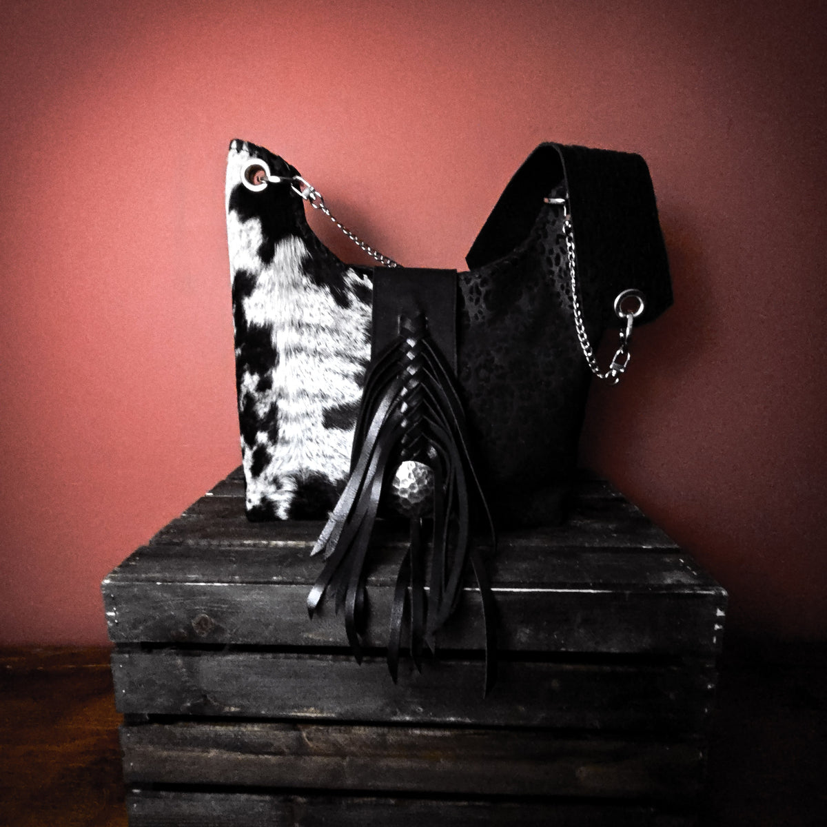 Uptown Cowgirl black-and-white hair-on-hide shoulder bag with black leather fringe