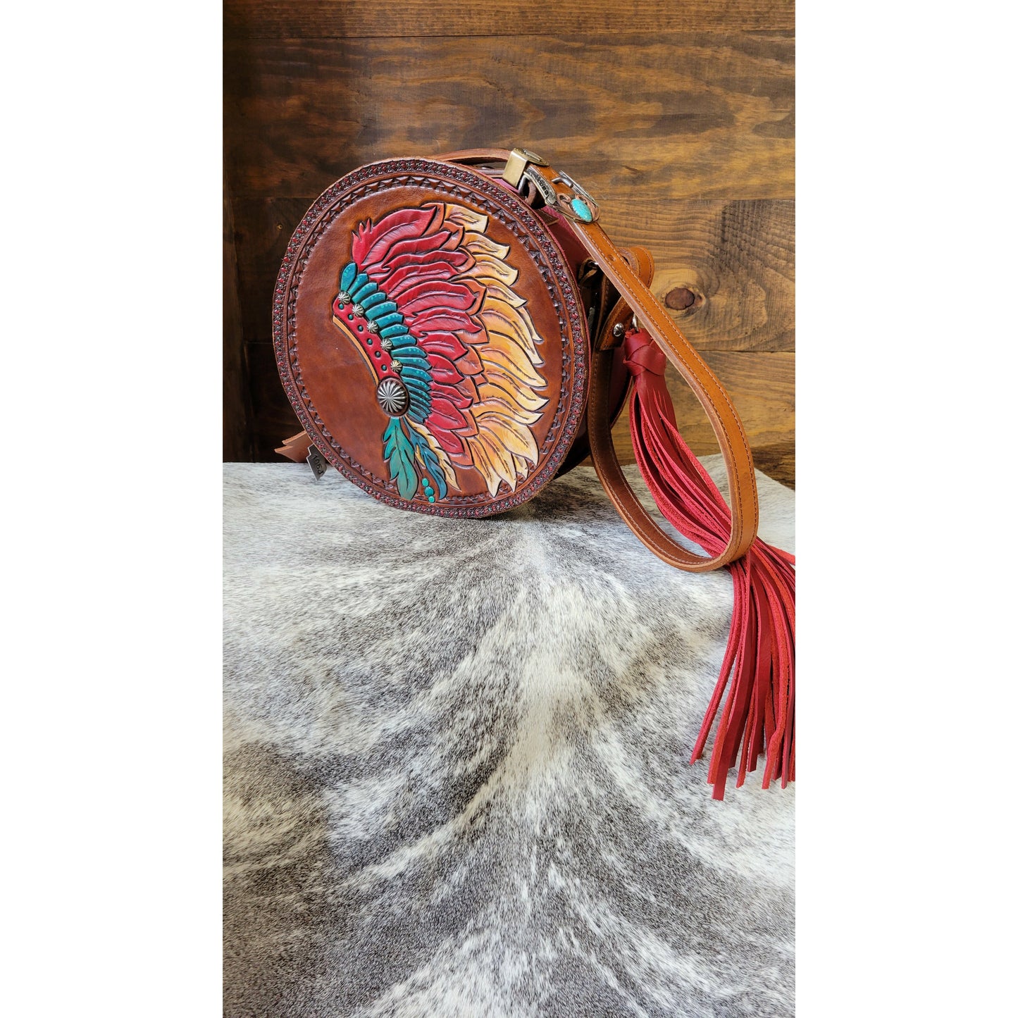 106J  Feather Headdress Round Purse angle view on cowhide